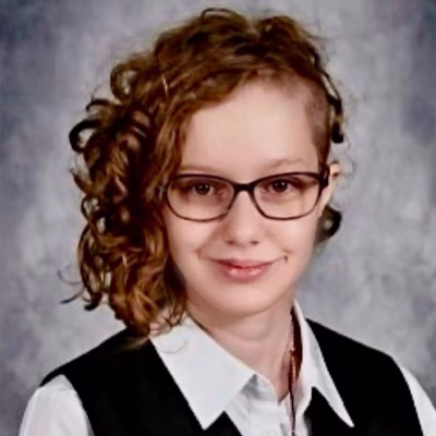 Maya-Rose Yancey smiling in a professional headshot