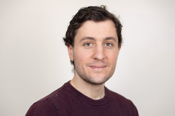Paul Zakin, Director of Research Technology and Marketing at University of Chicago, professional headshot wearing burgundy sweater