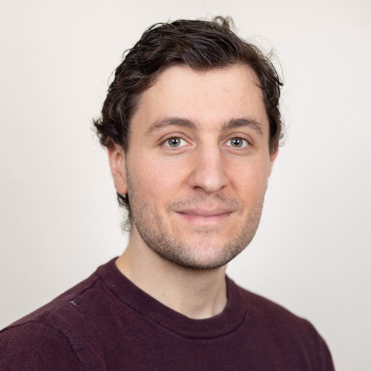 Photo of a man looking at the camera with a slight smile.